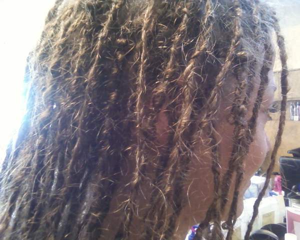 I started her locs by the interlocking method